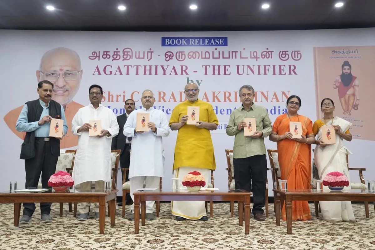 Seven people on stage each holding a copy of Agatthiyar – The Unifier at its release